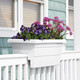 White Railing Flower Box with Flowers on a Front Porch Rail White Railing Flower Box with Flowers on a Front Porch Rail